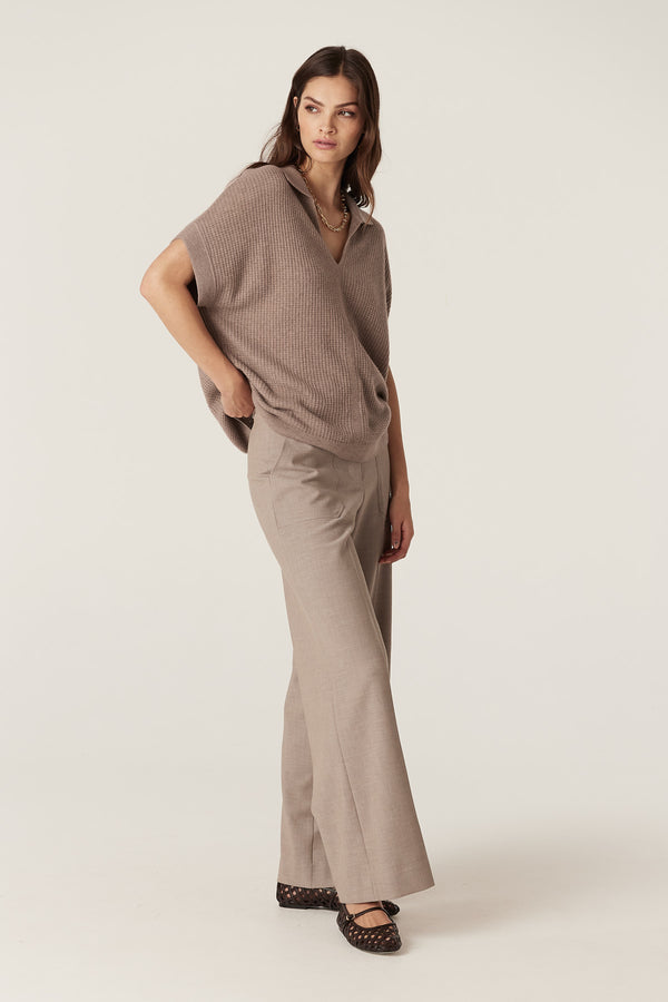 Woman wearing a mocha Cashwool Waffle Top with V-neck collar, relaxed fit, and matching trousers.