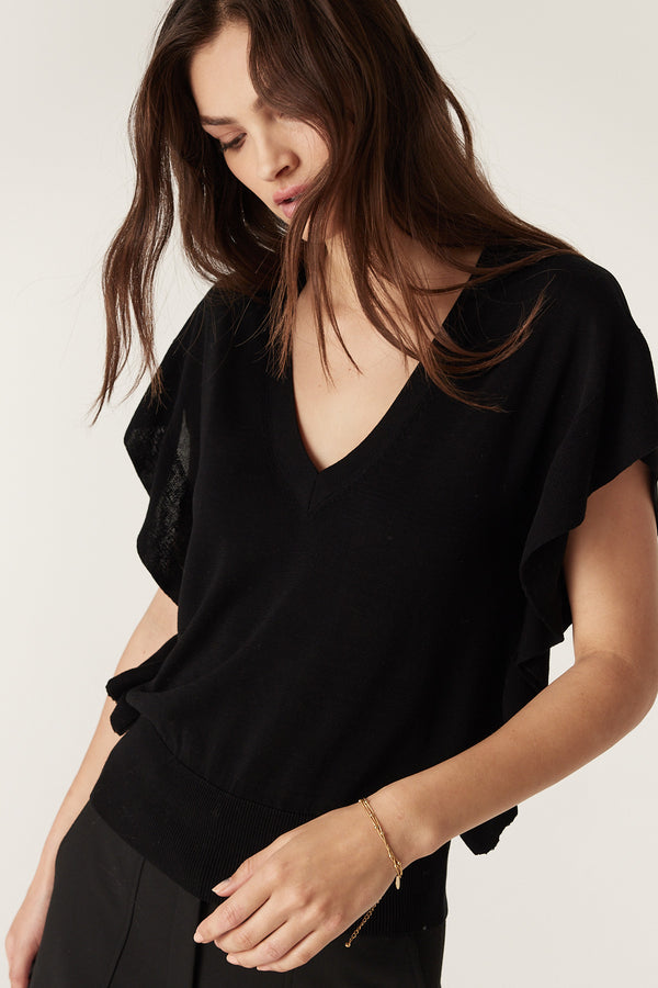 Black Silk Tencel Frill Top with V-neck, rib frill armholes and sides, worn by a model.
