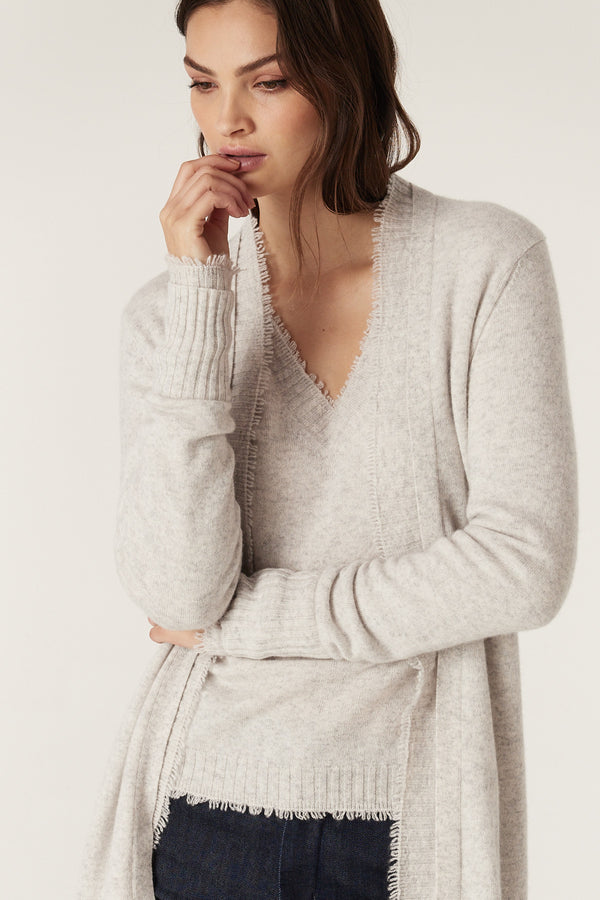 Model wearing a Frost Cashwool Aura Cardigan with fringed open front, ribbed cuffs, and relaxed fit.