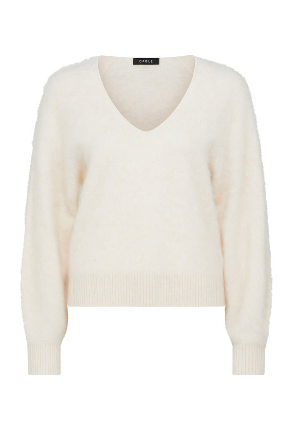 Parchment brushed cashwool V-neck jumper with ribbed cuffs and hem.