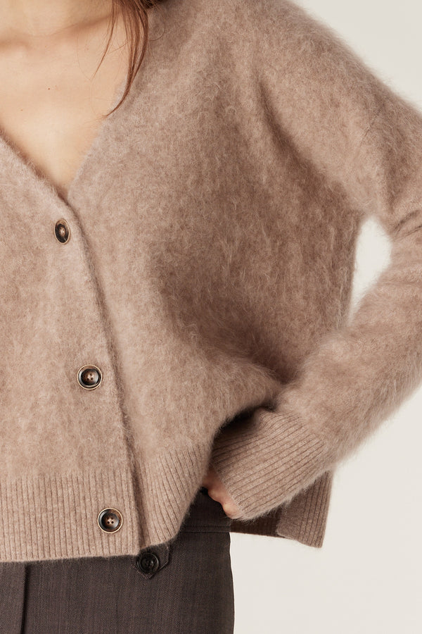 Mink brushed cashwool V-neck cardigan with button front, relaxed fit, and ribbed cuffs/hem.