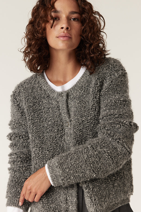 Ash grey teddy knit cardigan with textured boucle yarn, worn open over a white tee.