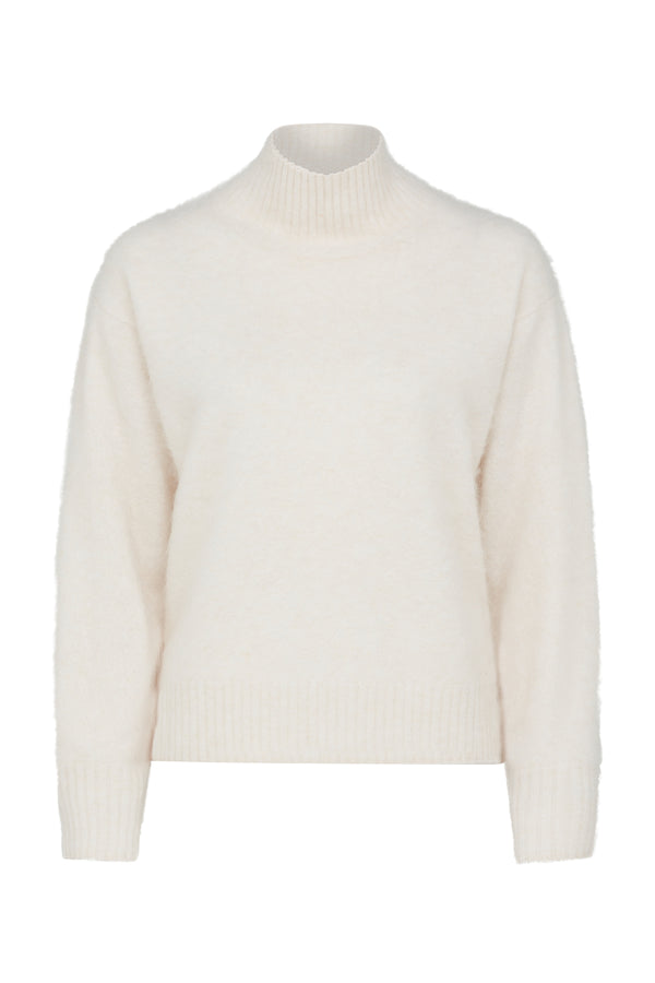 Parchment brushed cashwool turtle neck jumper with ribbed collar and cuffs.