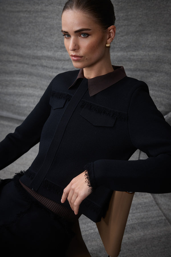 Black Crepe Fringe Jacket with brown collar, concealed zip, and faux pocket flaps on a model.