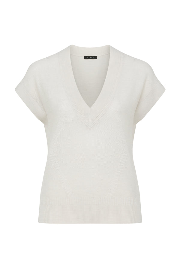 Antique white Abigail Merino wool top with V-neck, short sleeves, and subtle moss stitch texture.