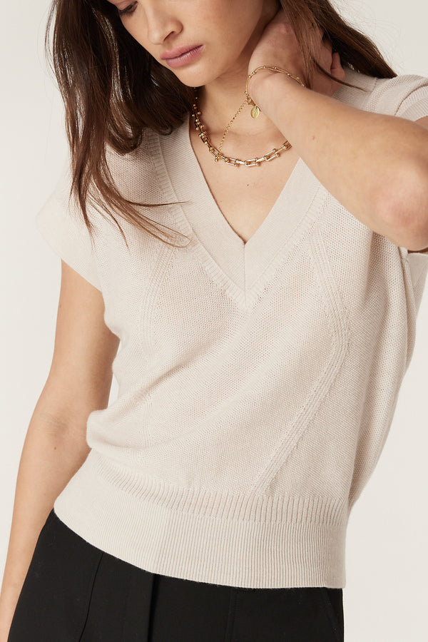 Abigail Antique White Merino wool V-neck top with moss stitch and rib details.