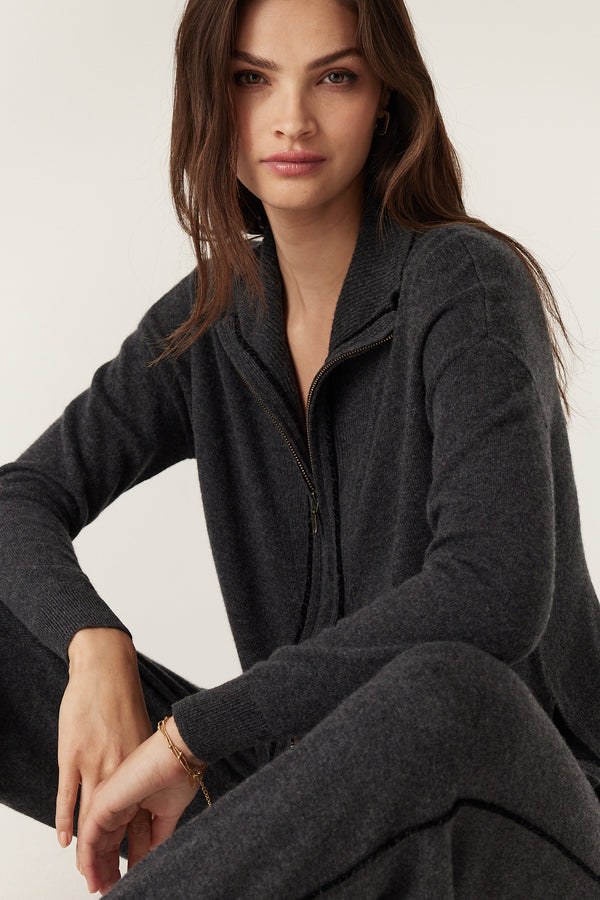 Woman wearing a charcoal Cashwool Track Zip Jumper with corded trim and rib detailing.