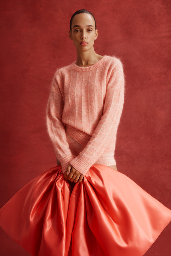 Model wears a melon mohair blend crew neck jumper with jersey stripe stitch and ribbed trims.