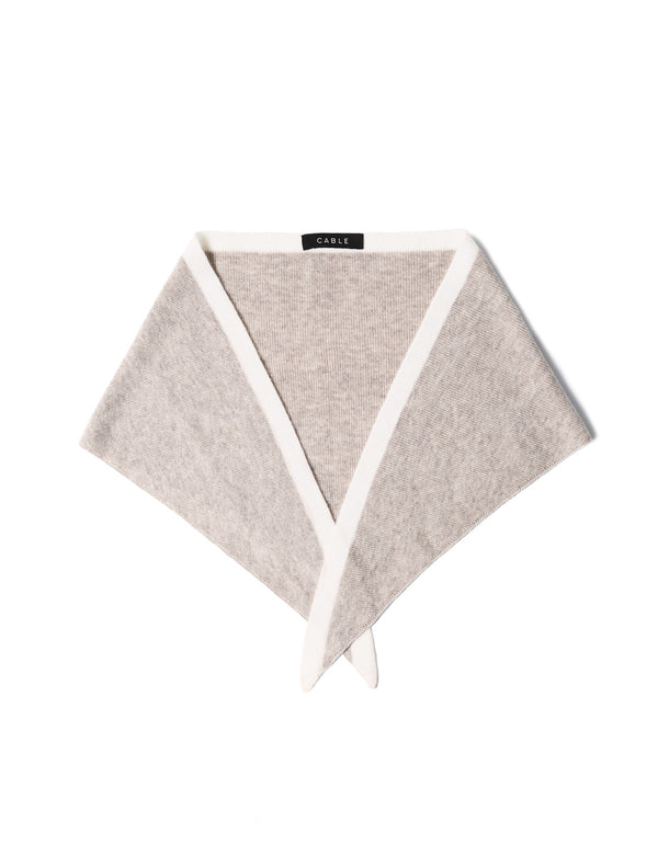 Oatmeal Cashwool neck scarf with white trim, folded into a triangular shape.