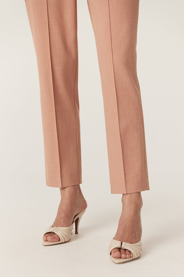 Clay Owen Pant with tapered leg, worn with cream heeled mules.
