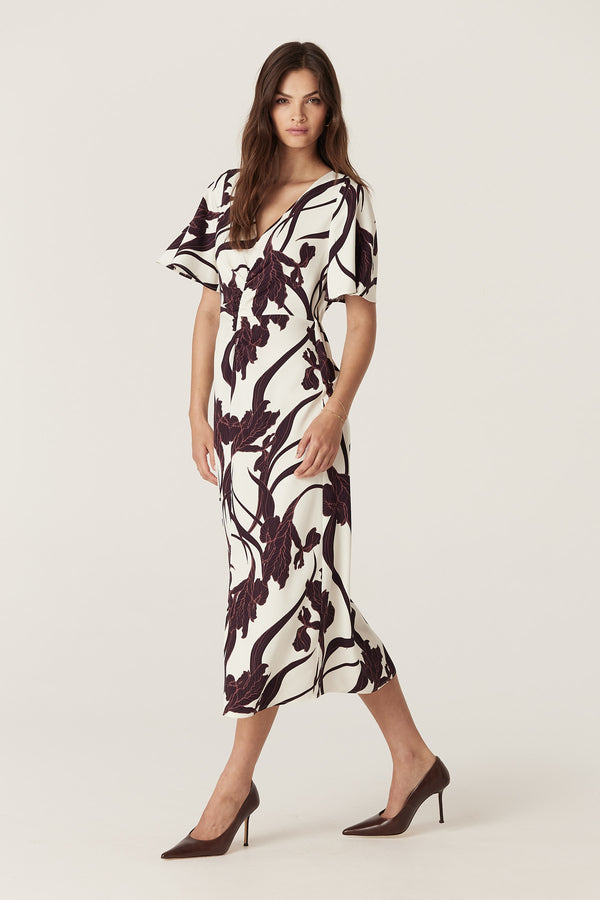 Neve Dress in Iris Print: relaxed fit, V-neck, flared sleeves, front split, and back elastic.
