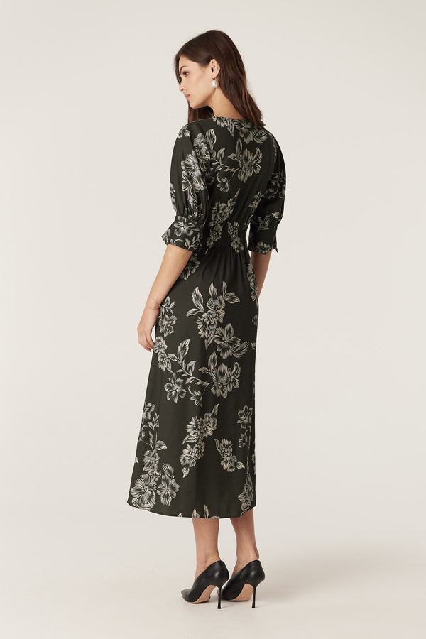 Holly Dress: Dark green satin back viscose midi dress with white floral print, V-neck, elbow sleeves, and wrap waist.