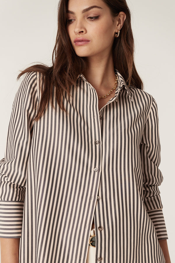 Woman wearing a Jamie Khaki Stripe Shirt with vertical black and cream stripes, button-through front, and classic collar.