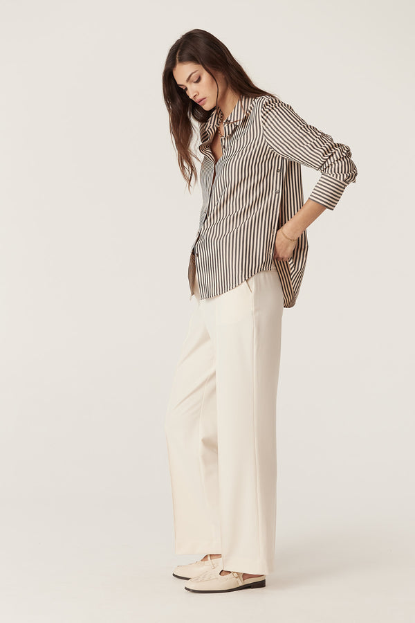 Woman wearing a Jamie Khaki Stripe Shirt with a classic collar, button front, and side body button opening.