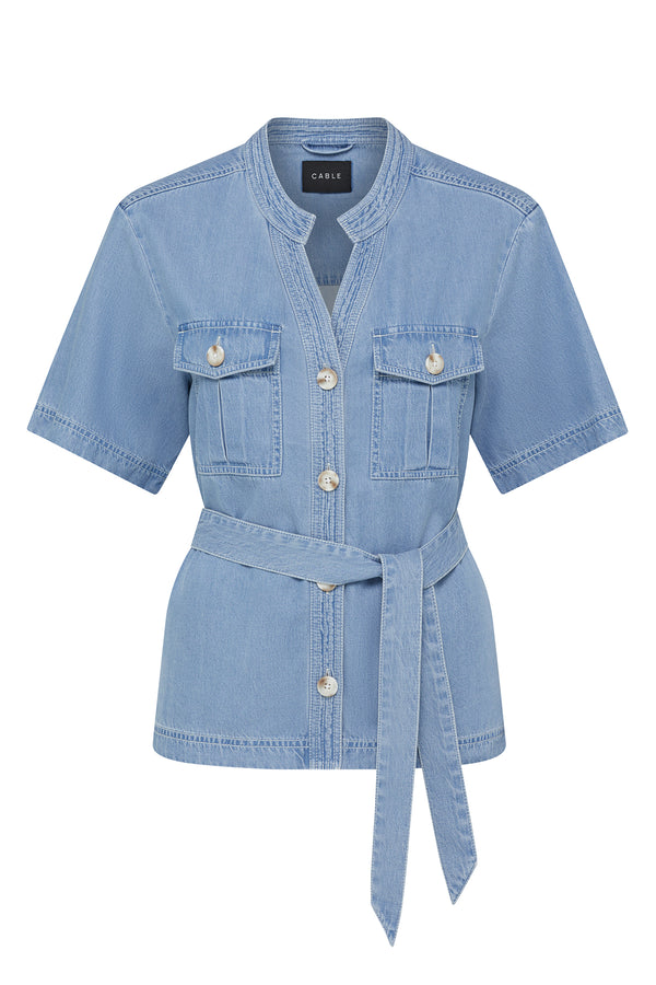 Blue lyocell-cotton blend Pearce Top with short sleeves, button front, utility pockets, and waist tie.
