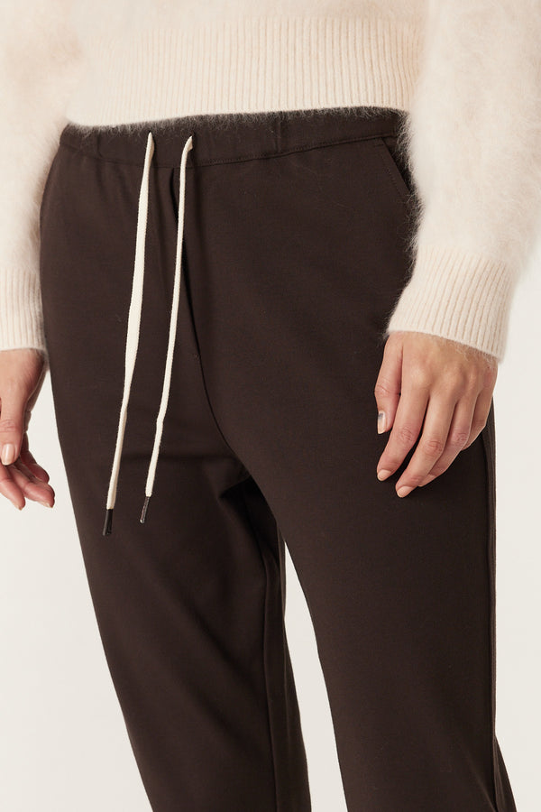 Close-up of Luca Twill Jogger in Espresso, showing elasticated waist with white drawcord and functional front pockets.