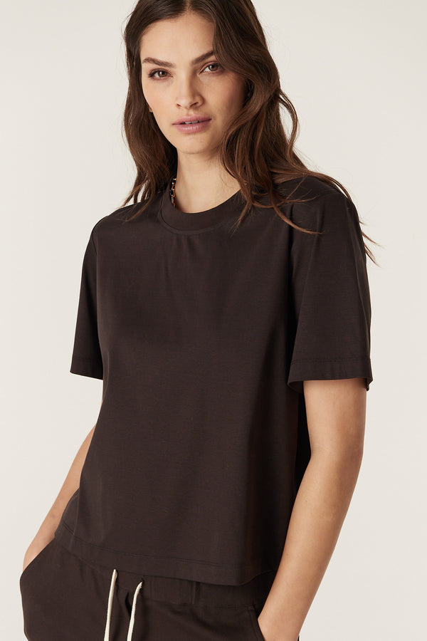 Woman wearing an Espresso Pima Boxy Tee with a relaxed fit, crew neck, and short sleeves.