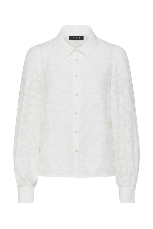 Ecru Vella Jacquard Blouse with textured fabric, shirt collar, button-through front, and soft gathered sleeves.