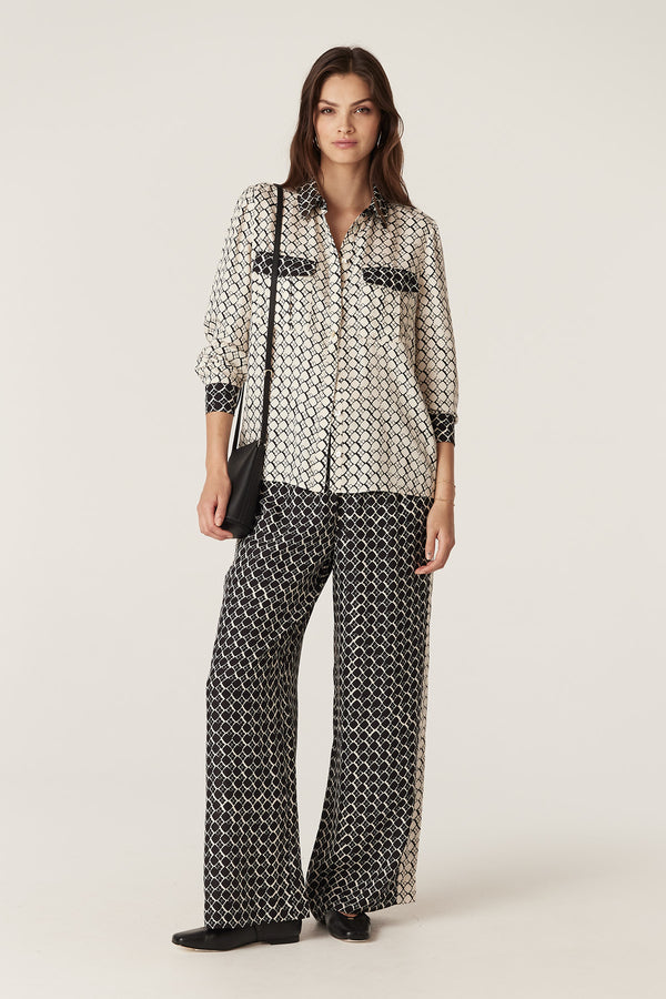 Hamilton Blouse in ivory geo print silk blend, with patch pockets and button cuffs, paired with matching pants.