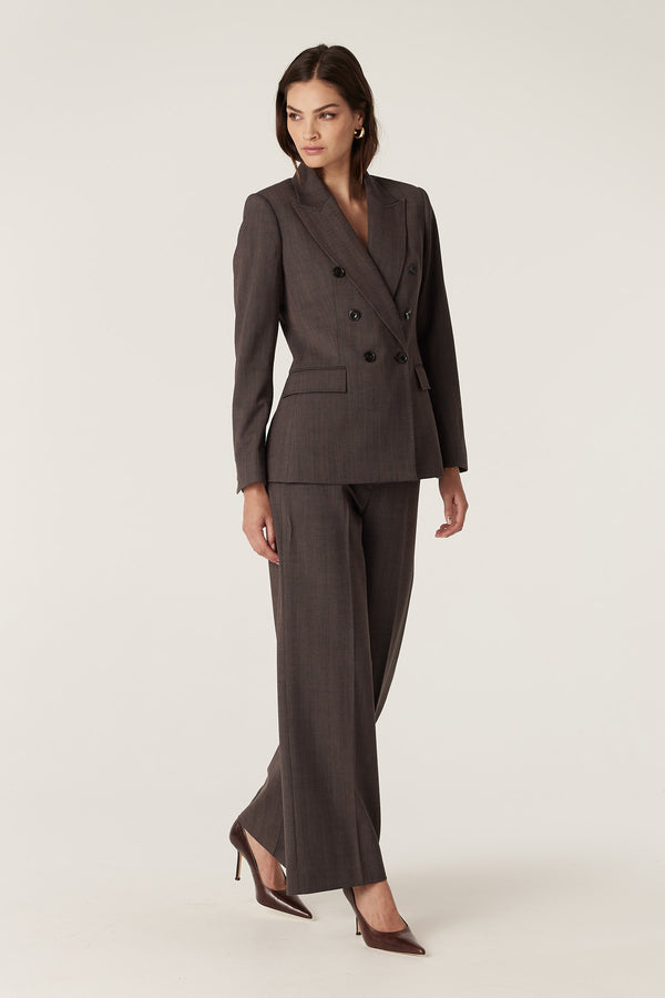 Woman in a mocha wool blend suit: double-breasted blazer and wide-leg pants.