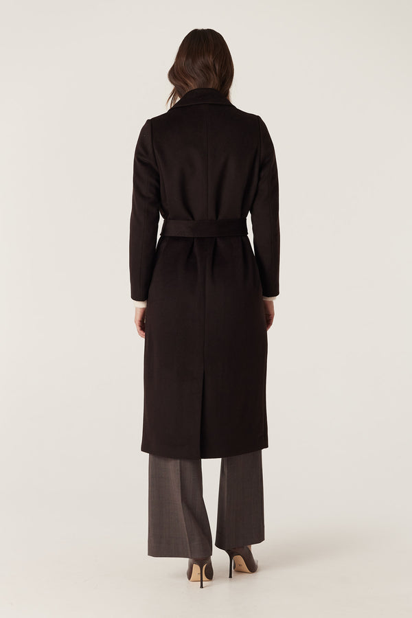 Woman in espresso Evans tailored wool coat with wrap closure and back vent.