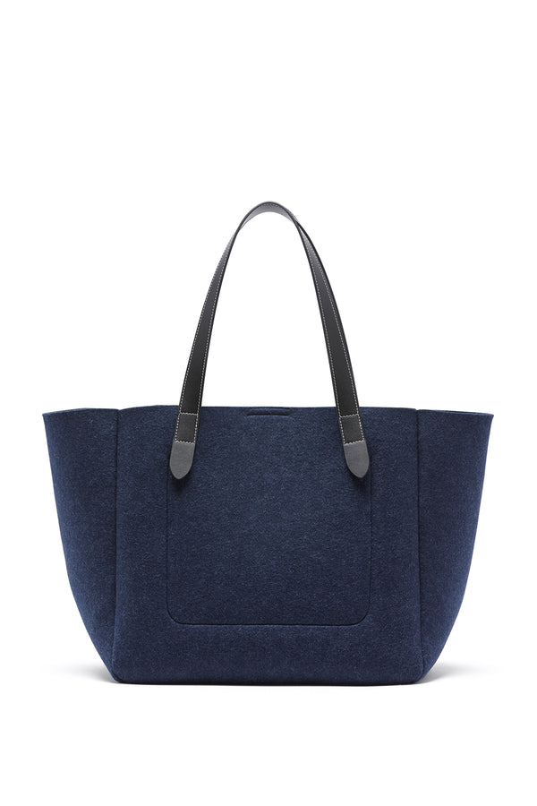 Indigo marle wool blend felt travel tote with black genuine leather handles.