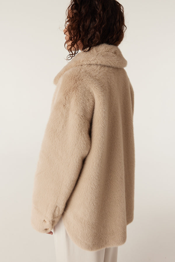 Franzi camel faux fur jacket with a wide collar, shown on a model from the back.