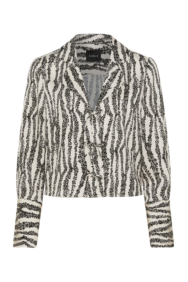 Sabine Blouse: White and black speckle print long-sleeve top with a collared neckline and button front.