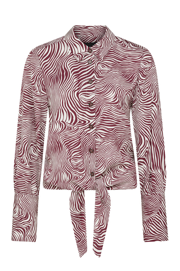 Muse Blouse: Burgundy and white zebra print long-sleeve shirt with a tie-front hem and button cuffs.