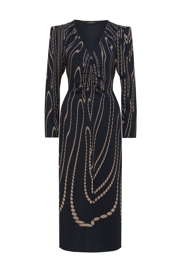 Navy camel spot Margaux dress with V-neck, long sleeves, and abstract chain pattern.