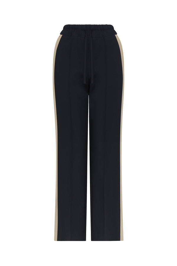 Navy Leah Pant with wide leg, drawstring waist, and tan side stripe.