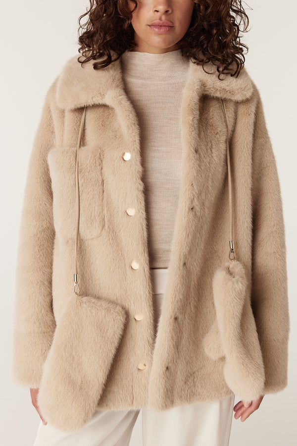 Camel faux fur coat with gold buttons, large pockets, and a matching turtleneck.
