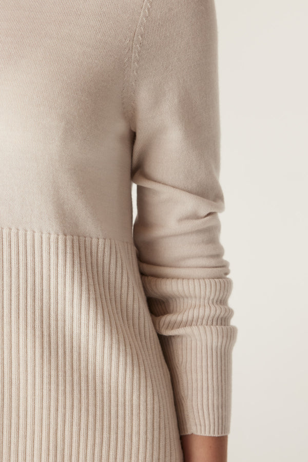 Antique white Merino wool jumper with a ribbed lower panel and deep ribbed sleeves.