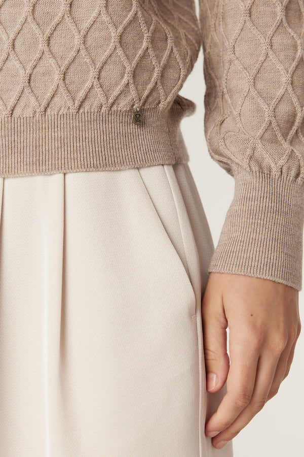 Pebble Merino wool jumper with diamond cable stitch, ribbed hem, and Heritage branded plate.