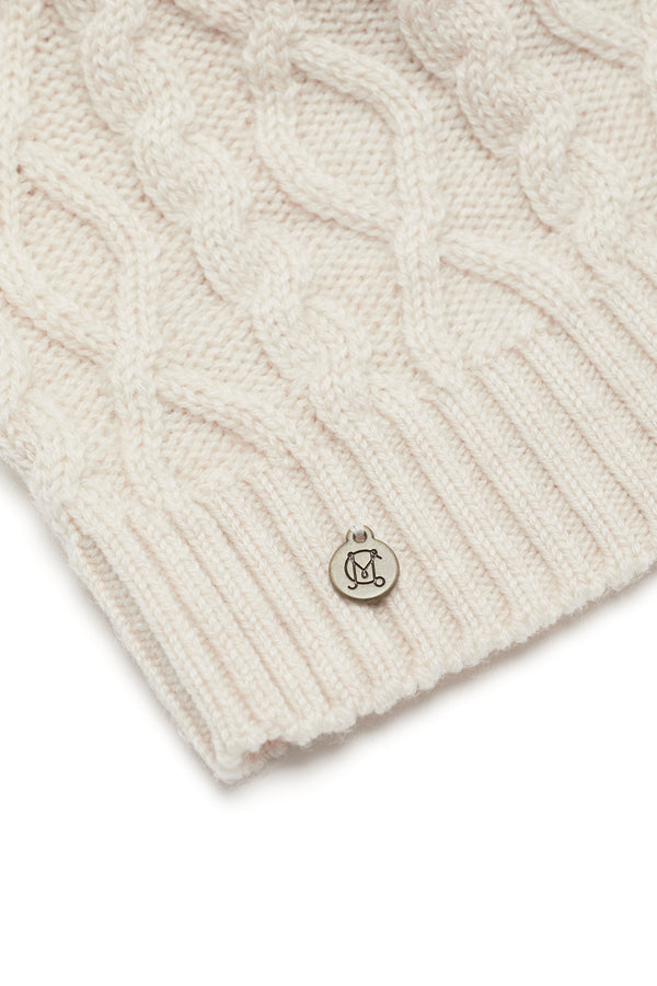 Oatmeal Merino wool beanie with diamond cable knit, ribbed hem, and silver Heritage branded plate.