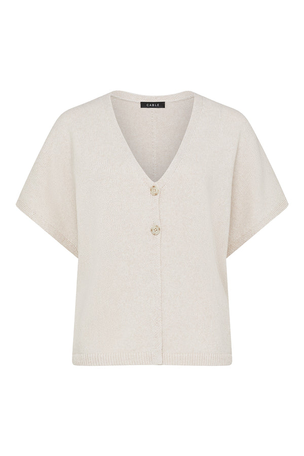 Calico-colored relaxed knit top with a V-neckline, two-button front placket, and ribbed hem detail.