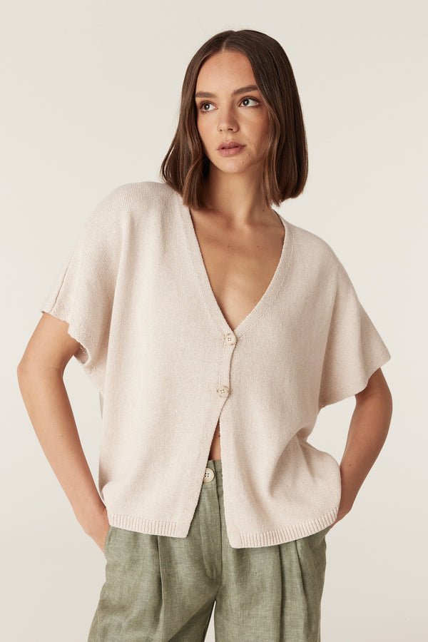 Calico relaxed-fit V-neck knit top with short sleeves, two-button front closure, and a ribbed hem.