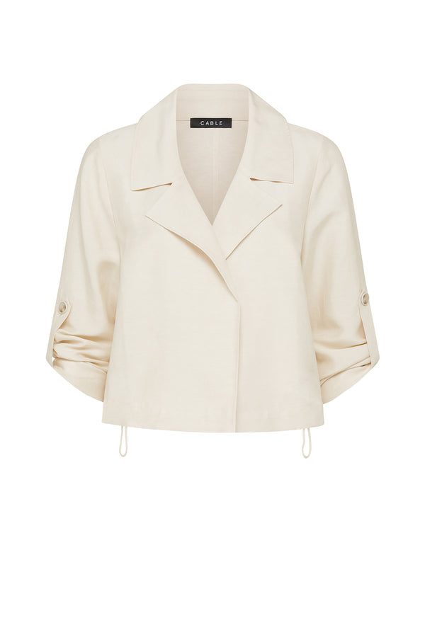 Ecru Goldie jacket in a relaxed fit with a collared open front, roll-up sleeve tabs, and an adjustable toggle hem.