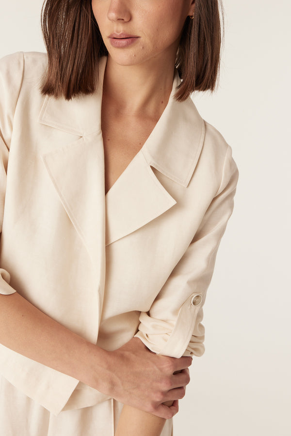 Ecru Goldie jacket with a collared open-front design and roll-up sleeve tabs in a relaxed, medium-weight fabric.