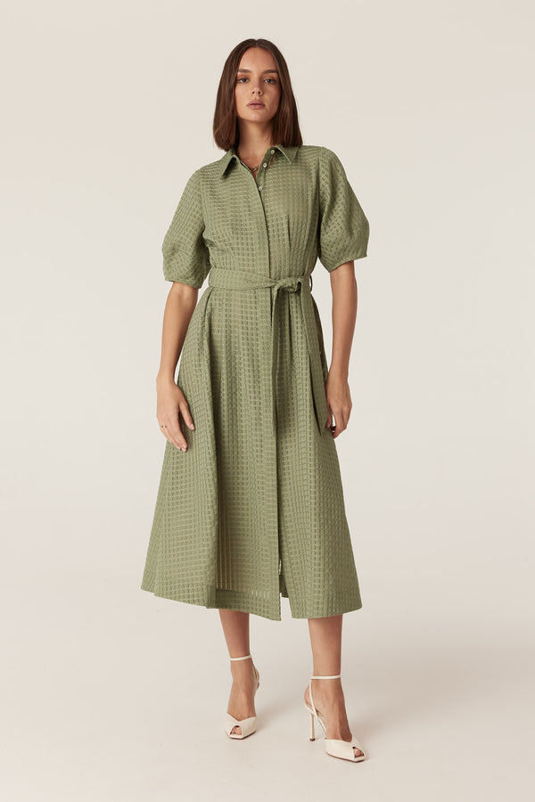 Olive midi dress in burnout textured fabric with a button-front, puff sleeves, and a matching tie waist belt.