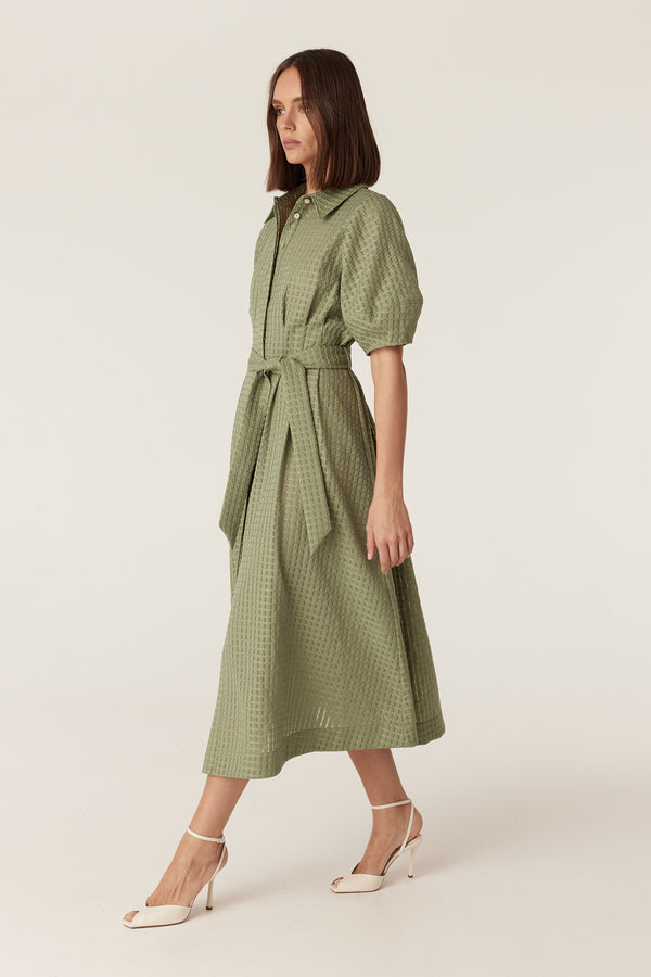 Olive midi dress in burnout textured fabric with a button-front, puff sleeves, and a matching tie waist belt.