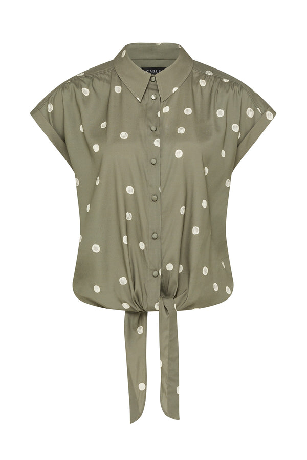 Sage green collared blouse with white polka dots, short cap sleeves, and a front tie-knot detail in a regular fit.