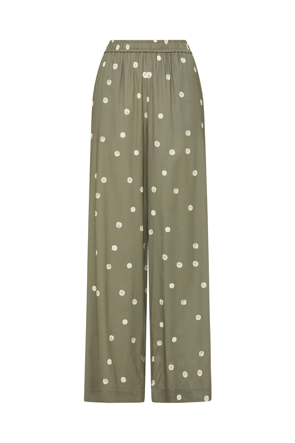Green wide-leg Muse pants featuring a white polka dot print, elasticated pull-on waistband, and side pockets.