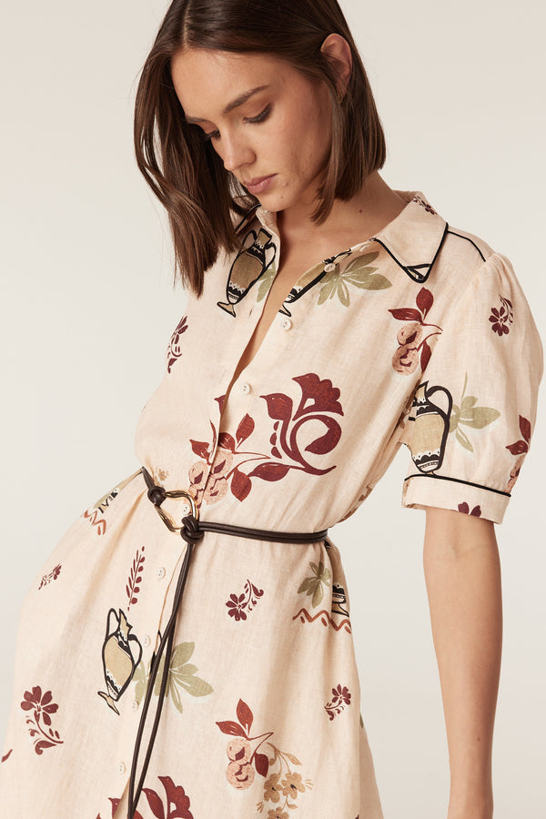 Avondale midi dress in rustic garden print French linen with contrast piping, button-through front, and a tie belt.