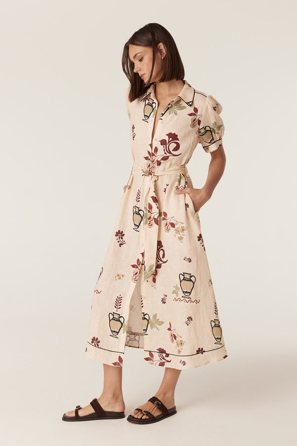 Avondale midi dress in rustic garden print French linen with a button-front, tie belt, and contrast piping.
