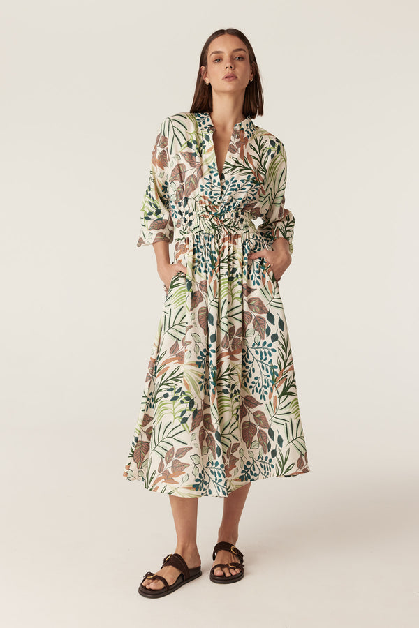 Olivia midi dress in a cream garden print with a collared neckline, 3/4 sleeves, and an elasticated waist.