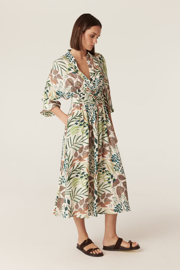Olivia midi dress in a cream garden print with a collared neckline, 3/4 sleeves, and an elasticated waist.