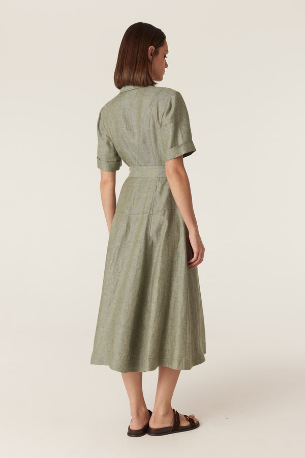 Back view of a green French linen midi dress with short sleeves, a collared neckline, and a belted waist.