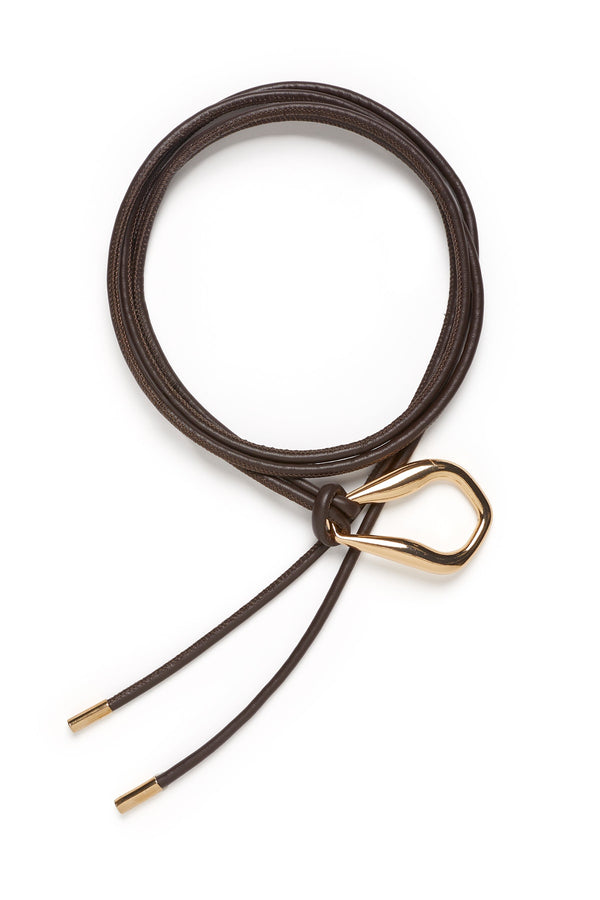Chocolate brown Venetian leather belt with a sculptural gold-tone buckle and adjustable tie ends.