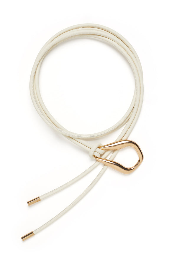 Ivory Venetian leather belt featuring a sculptural gold-tone buckle and adjustable cord design with gold-tipped ends.